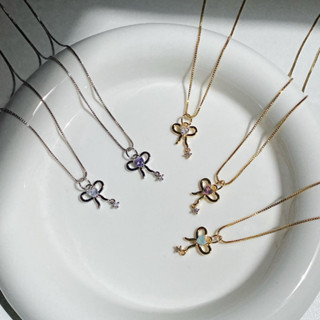 Petite Ribbon Necklace สร้อยคอรูปโบว์ประดับเพทาย