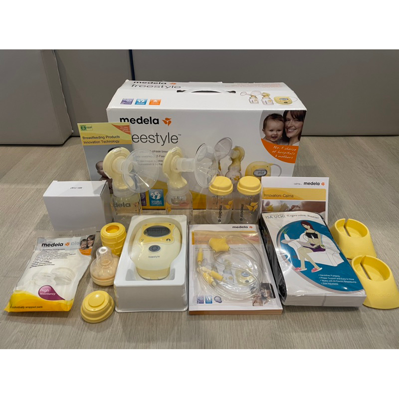 เครื่องปั๊มนมไฟฟ้า MEDELA รุ่น Freestyle Double Electric (มือสองสภาพ 90%) แถมเครื่องอุ่นนมพกพาและถุงเก็บน้ำนม