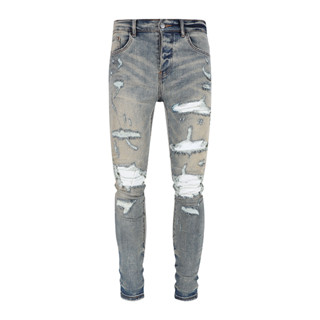 AMIRI denim wash water holes do old patchwork MX1 stretch slim jeans