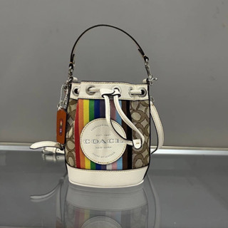 Coach CJ661 Mini Dempsey Bucket Bag In Signature Jacquard With Rainbow Stripe And Coach Patch