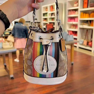 MINI DEMPSEY BUCKET BAG IN SIGNATURE JACQUARD WITH RAINBOW STRIPE AND COACH PATCH (COACH CJ661)