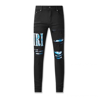 AMIRI black hole patch blue letter micro elastic slim-fit jeans