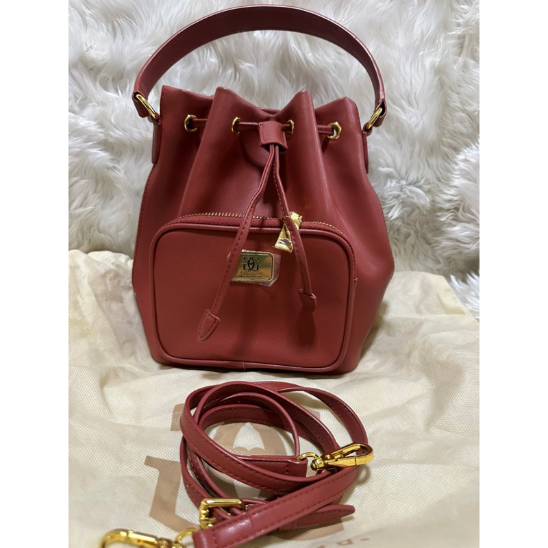 กระเป๋าทรงขนมจีบร้านlove goodสีส้มแดงตุ่นๆ