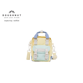 DOUGHNUT BAG : MACAROON TINY MONET SERIES  : BUTTERY X LIGHT AQUA ดีไซเนอร์รุ่นใหม่ของเรา มีเป้าหมายที่จะออกแบบกระเป๋าคุณภาพสูงและใช้งานได้จริง ให้กับลูกค้า สไตล์ขี้เล่น สีสันสดใส กระเป๋าโดนัทเป้สะพายหลัง น้ำหนักเบา หนังแท้ กันน้ำ  (รหัสสินค้า 09712 )