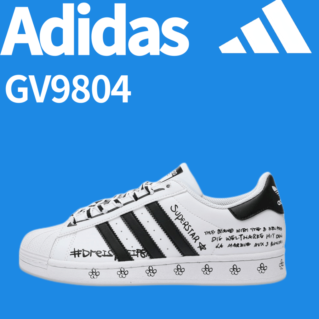 Adidas Originals Superstar รองเท้ากีฬาซีรีส์หัวเปลือกหอยคลาสสิกรองเท้าสเก็ตบอร์ดกราฟฟิตีดอกไม้สีขาวและสีดำ GV9804