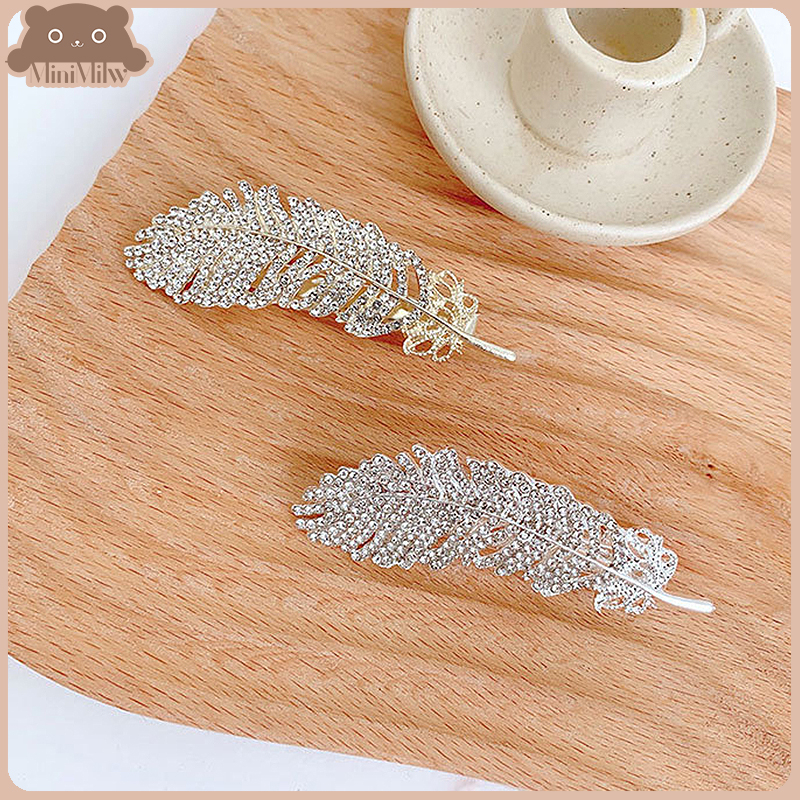 [พร้อมส่ง] กิ๊บติดผมขนนก ประดับเพชร น่ารักสไตล์เกาหลี หรูหราใส่ออกงานได้ มี 2 สี ทอง เงิน : MiniMilwʕ•ᴥ•ʔ