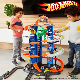 Hot Wheels ชุดติดตามรถของเล่น City Ultimate Garage พร้อมไดโนเสาร์ T-Rex ที่เก็บยานพาหนะขนาด 100+รถของเล่น 2 คัน