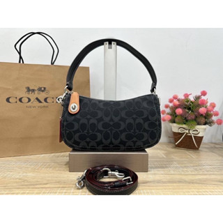 Coach Swinger in Signature Denim CA103