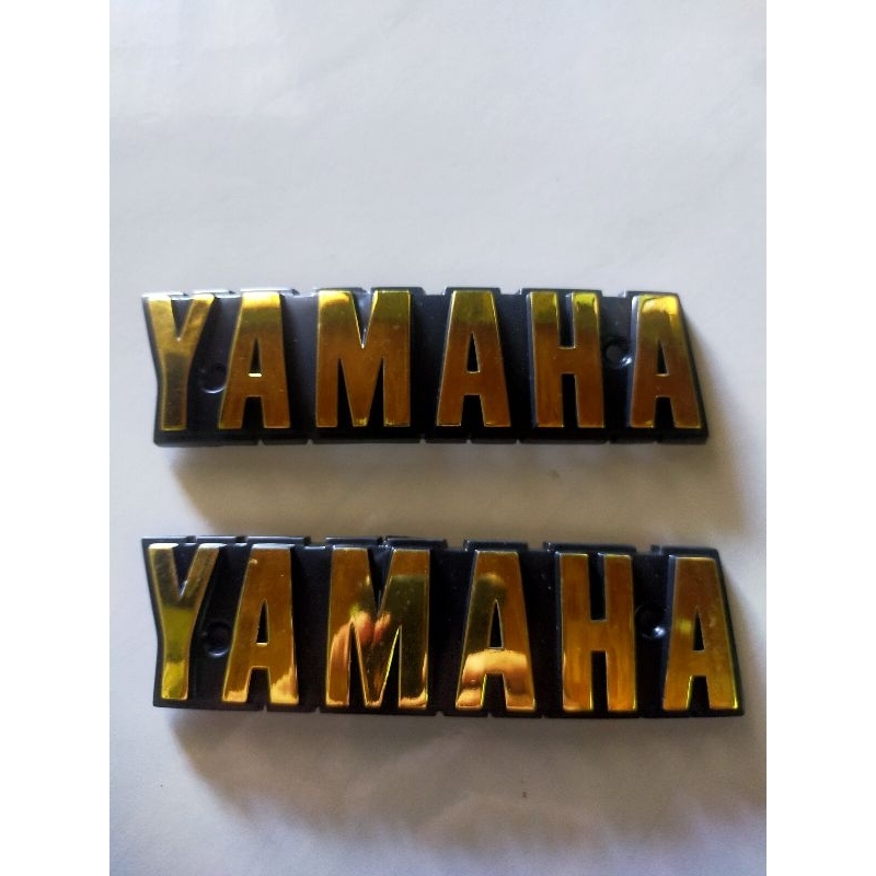 โลโก้ ถังน้ำมัน Yamaha RX100 มีน๊อตยึด2ข้าง 