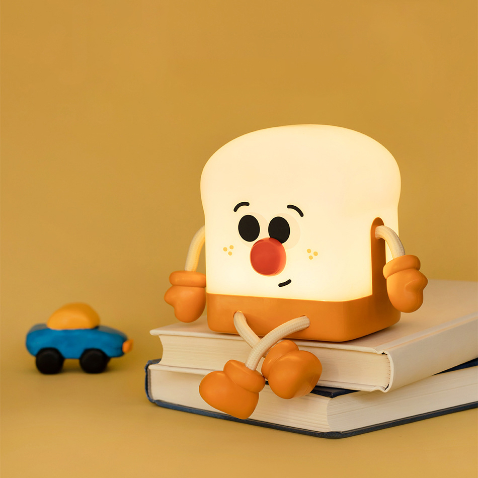 Toast Boy ไฟกลางคืนการ์ตูนน่ารักตกแต่งโทรศัพท์มือถือยืนชาร์จห้องนอนของขวัญวันเกิดสร้างสรรค์ของขวัญไฟกลางคืนดอกไม้