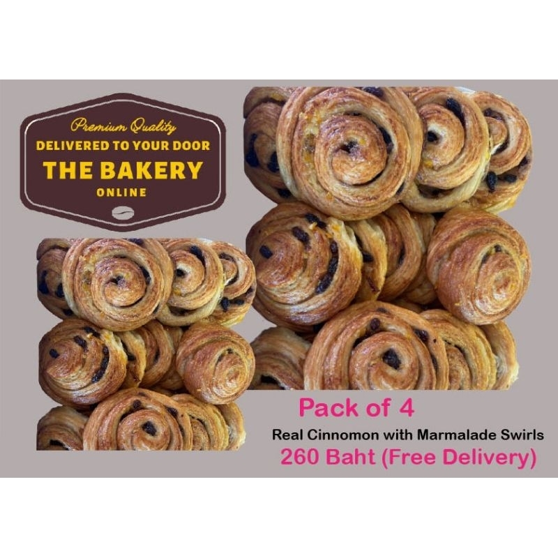 Cinnamon swirls with rasin and marmalade topping