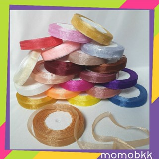 ริบบิ้นผ้าแก้ว กว้าง 1.5 ซม. มีหลายสี ยกม้วนประมาณ 38-42 เมตร