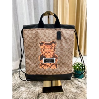 👜🥳กระเป๋าใส่ของจิปาถะ NEW COACH TERRAIN DRAWSTRING BACKPACK IN SIGNATURE CANVAS WITH VANDAL GUMMY