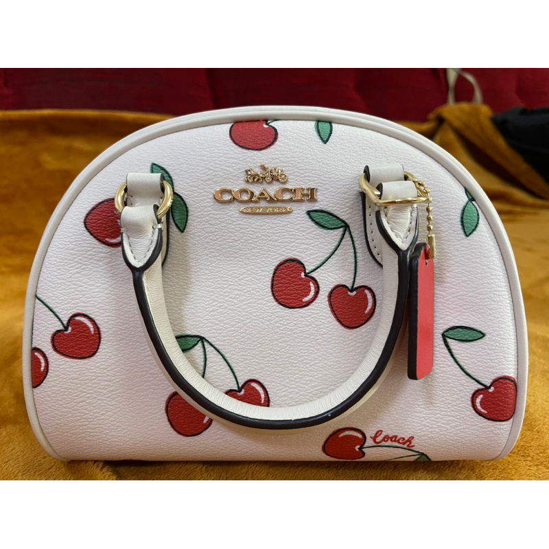 Coach Sydney Satchel with cherry heart print