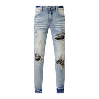 AMIRI slim blue complex wash water ripped patch micro-elastic jeans