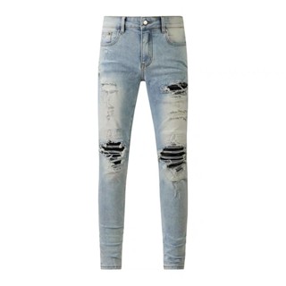 AMIRI ripped patch micro-elastic small feet slim-fit jeans