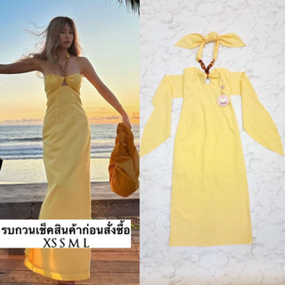 Dress เกาะอกตัวยาว แต่งสายโซ่ผูกคอ บิดเกรียวช่วงอกด้านหน้า เว้าช่วงอกเล็กน้อย ผูกโบว์เข้ารูปด้านหลัง ช่วงเอวเข้ารูปใส่ออ