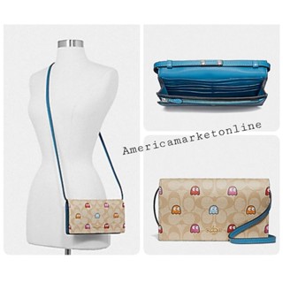 กระเป๋า COACH/ HAYDEN FOLDOVER CROSSBODY CLUTCH IN SIGNATURE CANVAS WITH PAC-MAN GHOSTS PRINT (COACH F73447)