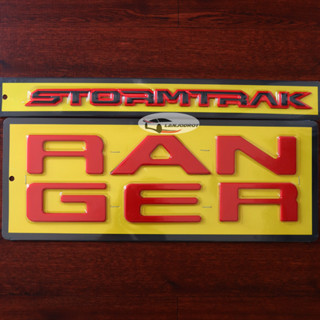 ชุด 2 ชิ้น โลโก้ใหญ่ RANGER สีแดง ติดร่อง ฝากระโปรงท้าย + STORMTRAK สีดำขอบแดง สตอร์มแทรค สำหรับ New Ford Next Gen Range