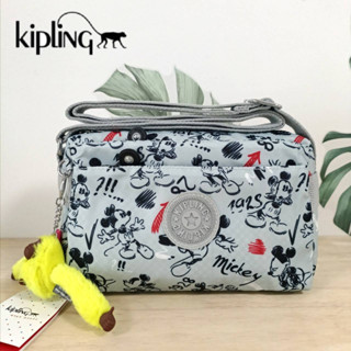 กระเป๋าสะพายข้าง KIPLING Mini Crossbodybag กระเป๋าสะพายข้างลายมิคกี้เทา ขนาดกะทัดรัด ผลิตจากวัสดุ Nylon+Polyester100%