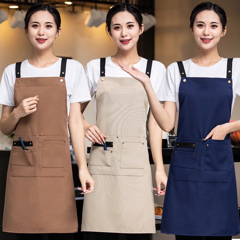 ผ้ากันเปื้อนคล้องคอ ปรับได้ เเต่งกระดุม มีกระเป๋าหลายช่อง ใส่ได้ทั้งชายเเละหญิง สายไขว้หลัง