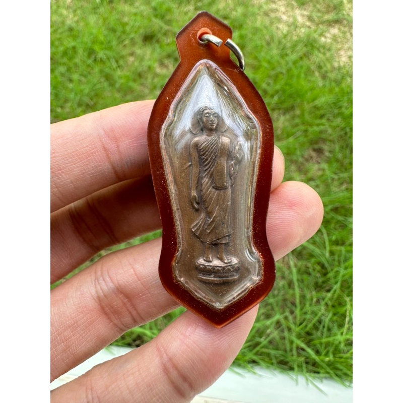 พระพุทธ25ศตวรรษ เนื้อนาค ปีพ.ศ.2500 (พร้อมเลี่ยมกรอบกันน้ำ)