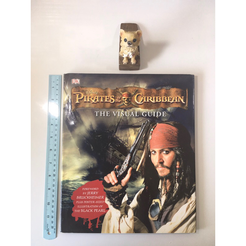 Disney Pirates of the Caribbean the Visual Guide (กระดาษรองปกมีรอยฉีก) หนังสือภาษาอังกฤษมือสองปกแข็ง