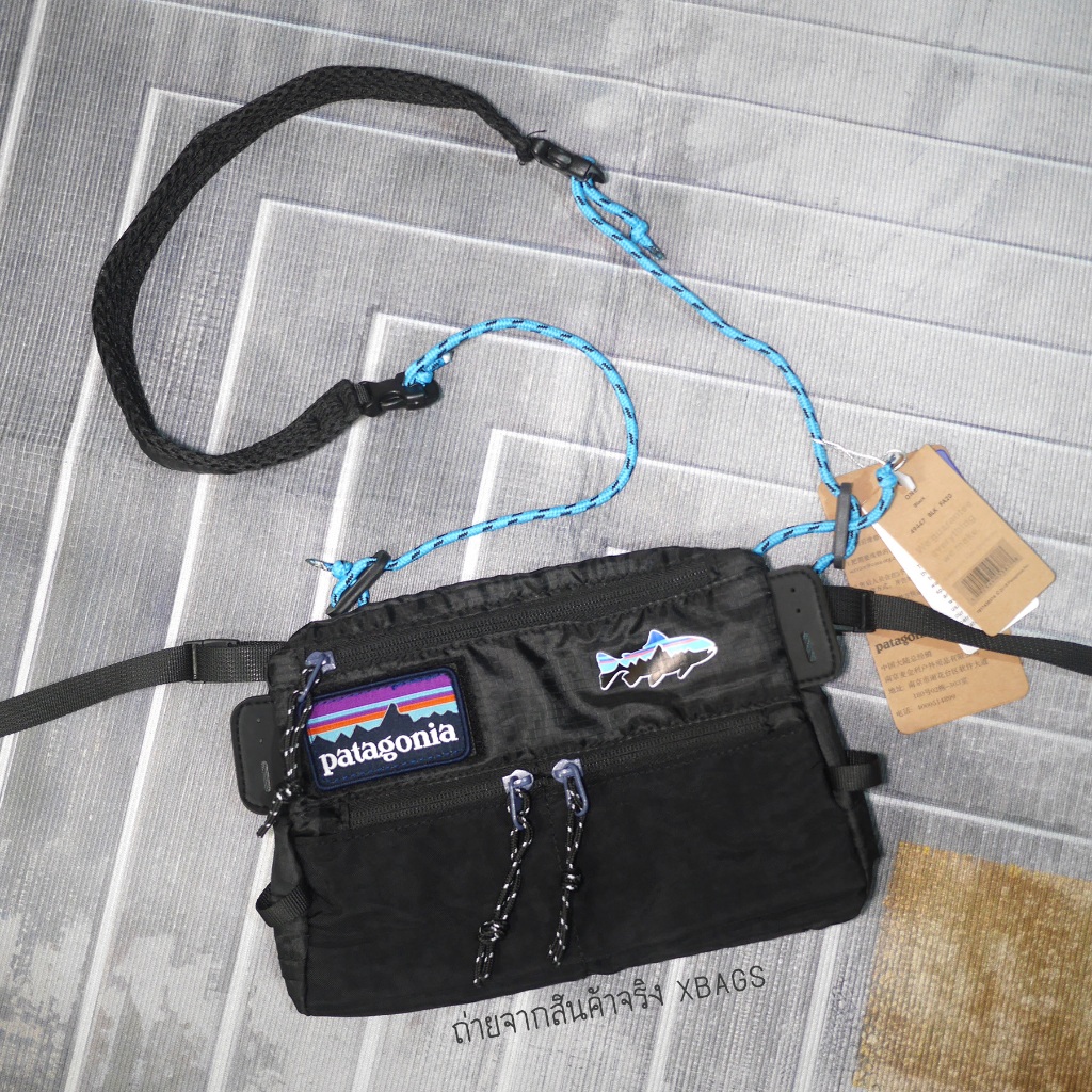 Patagonia สะพายข้างผ้าร่มแบนแนบตัว น้ำหนักเบา พับได้ สายเชือก ปรับสั้นยาวได้ มีซับไหล่