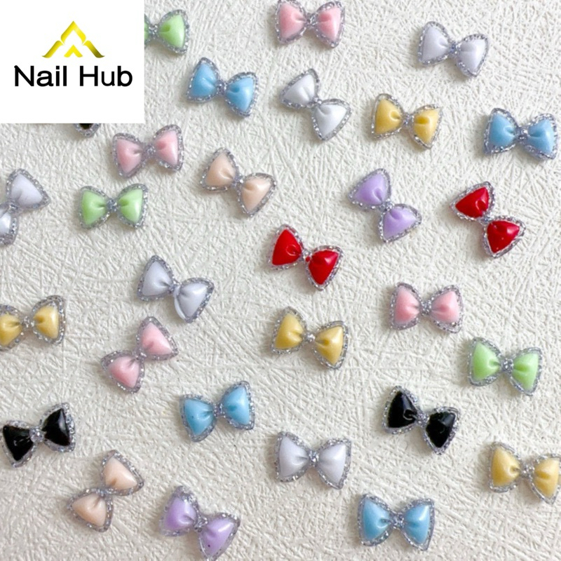 AC.237 ร้านไทย แพ็ค 2 ชิ้น มีให้เลือก 9 สี พร้อมส่ง อะไหล่แต่งเล็บเรืองแสง รูปโบว์ล้อมด้วยกากเพชร