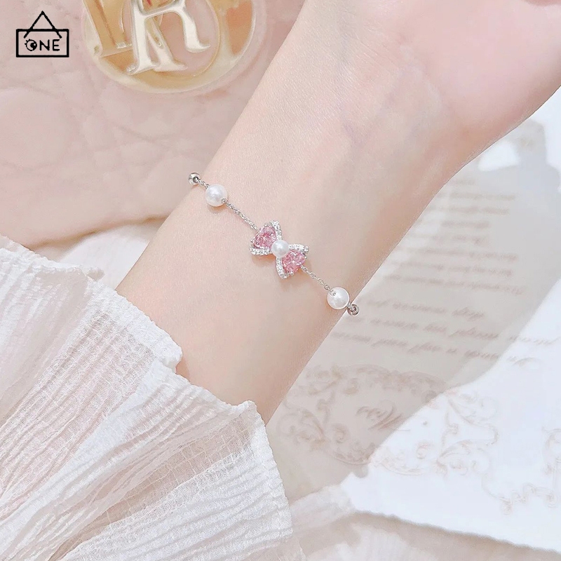COD❤️สร้อยข้อมือโบว์เพทายสีชมพูมุกหวานแฟชั่นสไตล์เกาหลีหรูหราระดับไฮเอนด์เครื่องประดับสำหรับผู้หญิงของขวัญ-a.one