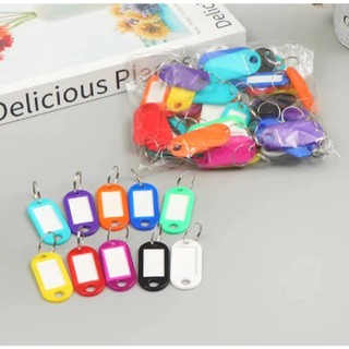 15pcsพวงกุญแจที่มีสีสันป้ายแก็กรหัสชื่อ โทรหมายเลข เครื่องหมายแท็กสัมภาระ
