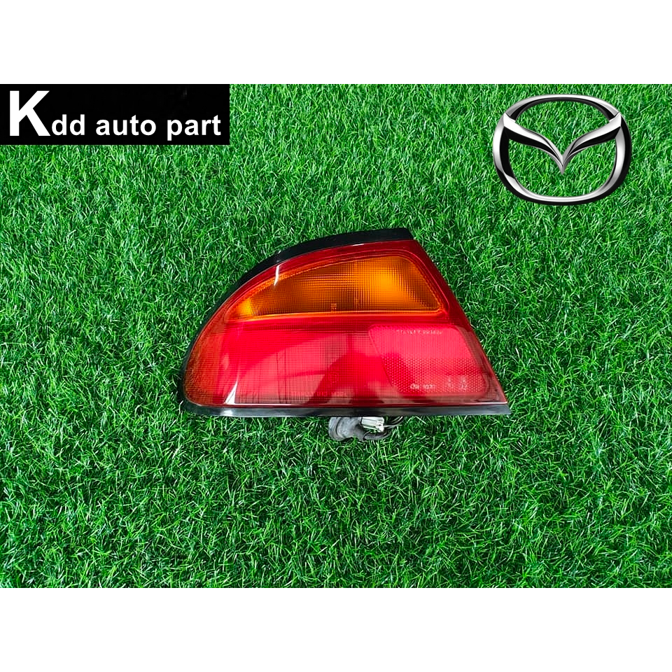ไฟท้าย ( ด้านซ้าย ) ของแท้ Mazda 323 Astina ตาหยี