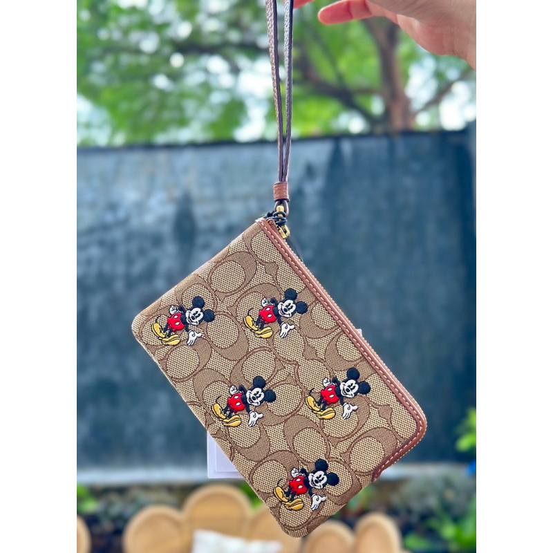 กระเป๋า Coach แท้💯คล้องมือ “Disney X Coach Corner Zip Wristlet In Signature Jacquard With Mickey Mou
