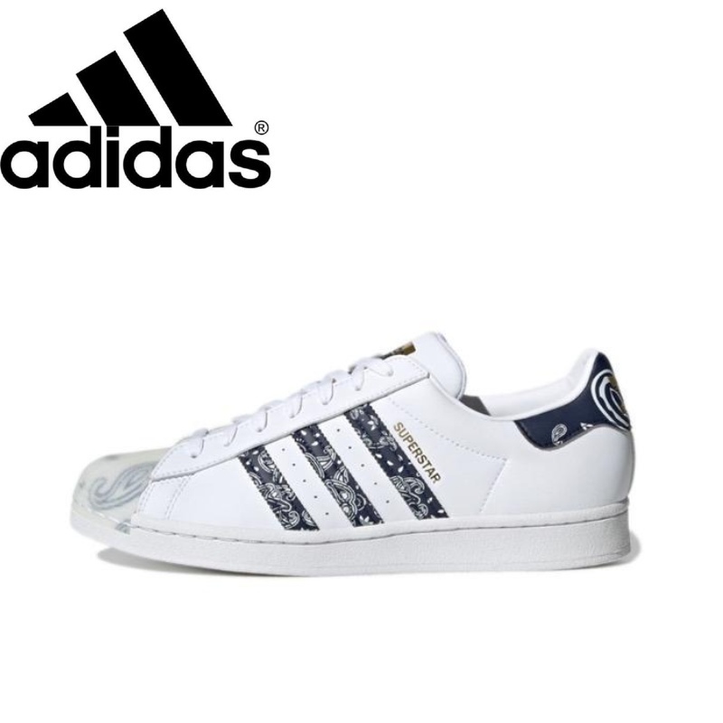 Adidas ของแท้ 100% Superstar รองเท้าผ้าใบสวมลำลองสวมต่ำสีขาวน้ำเงิน