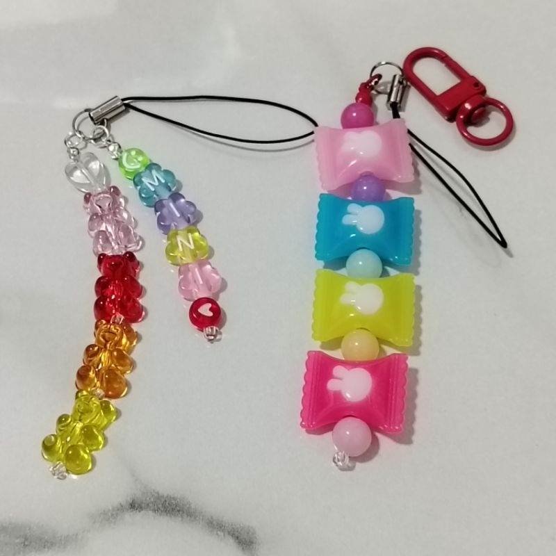 สายห้อยโทรศัพท์ หรือพวงกุญแจ สามารถเลือกได้ PHONE STRAP/KEY RING