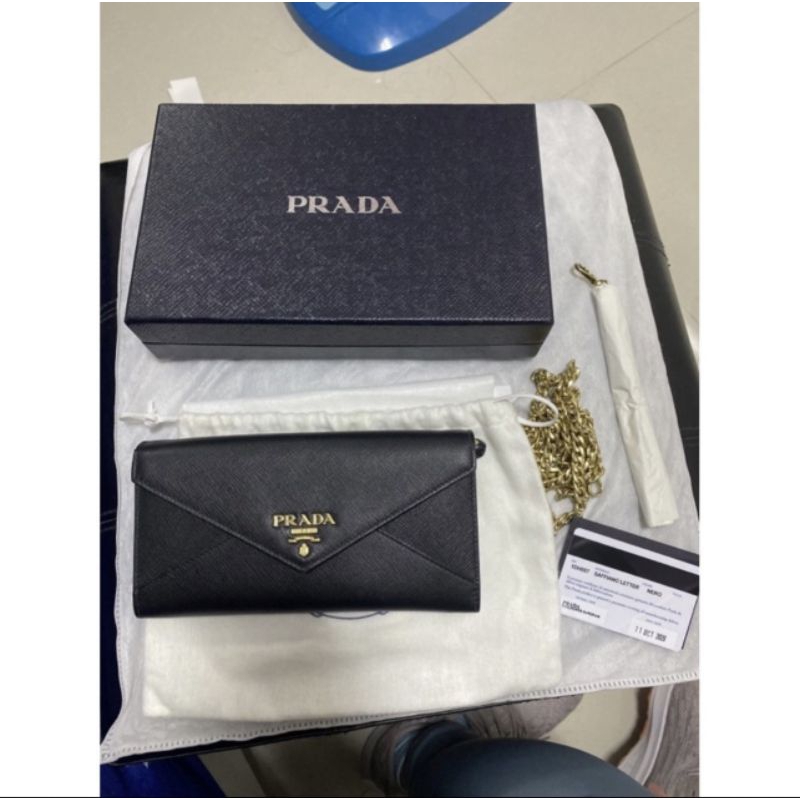 prada Saffiano leather wallet with shoulder strap  (used like new)