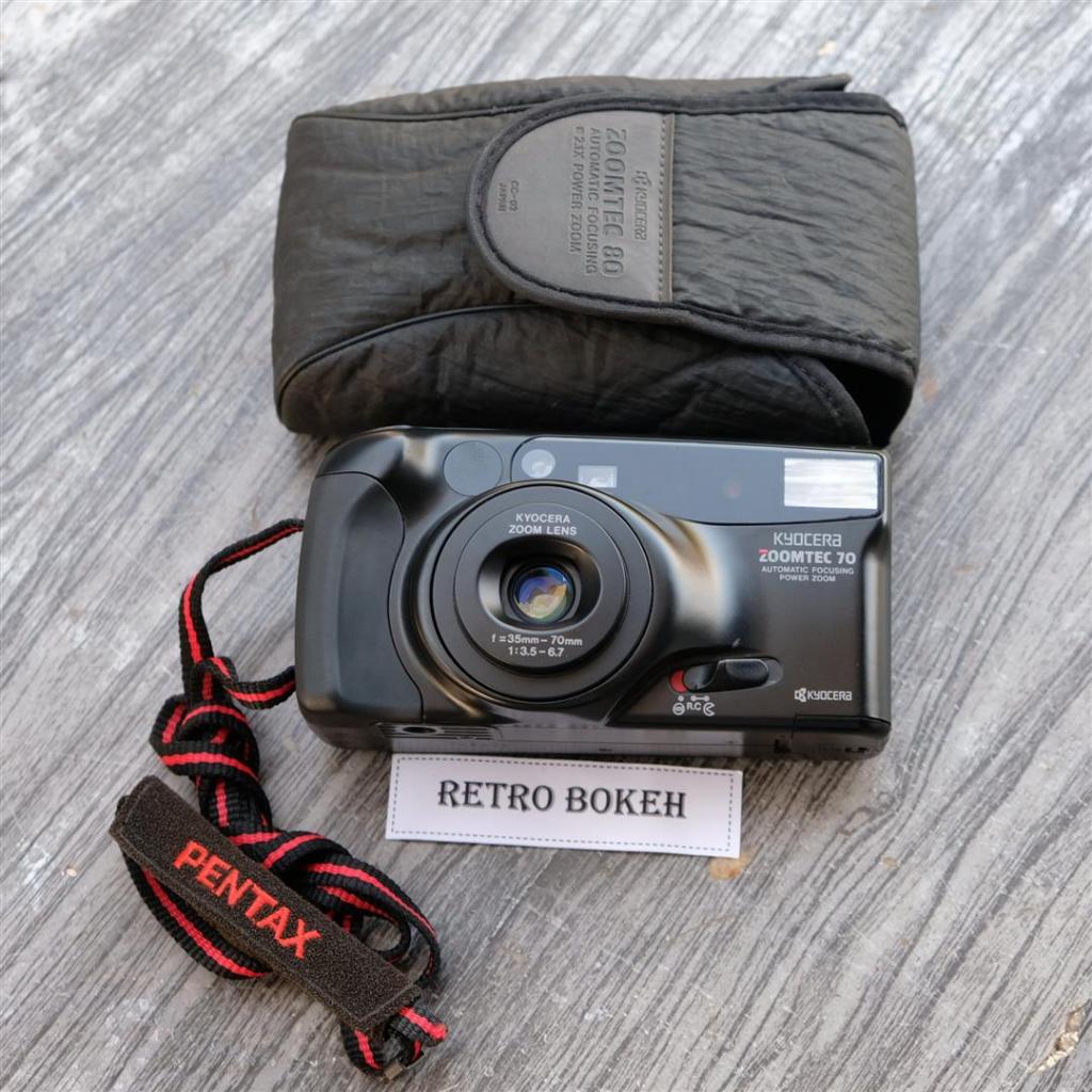 กล้องฟิล์ม KYOCERA  ZoomTec70 เลนส์ 38mm-90mm สวย สภาพดี ใช้งานง่ายเล็งแล้วถ่าย มาพร้อม 1.สาย 2.ถุงเคสใส่กล้อง ครบชุด