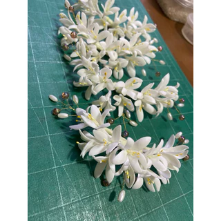 ดอกปีบติดผมดินปั้น(ไม่มีหวีเสียบ) มีห่วงไว้ติดกิ้ปเำให้ ดัดได้ ติดผมเจ้าสาว นางรำ รำย่าโม บ้านผ้าภูษามาส