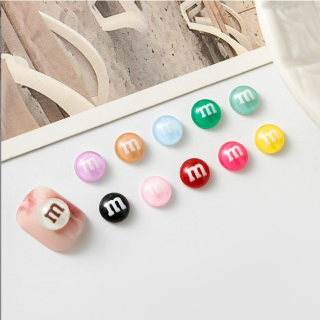 Q4.[B:D/4] อะไหลตกแต่งเล็บคละสี M&M หนึ่งถุงมี 30 ชิ้นคละสี [BB]