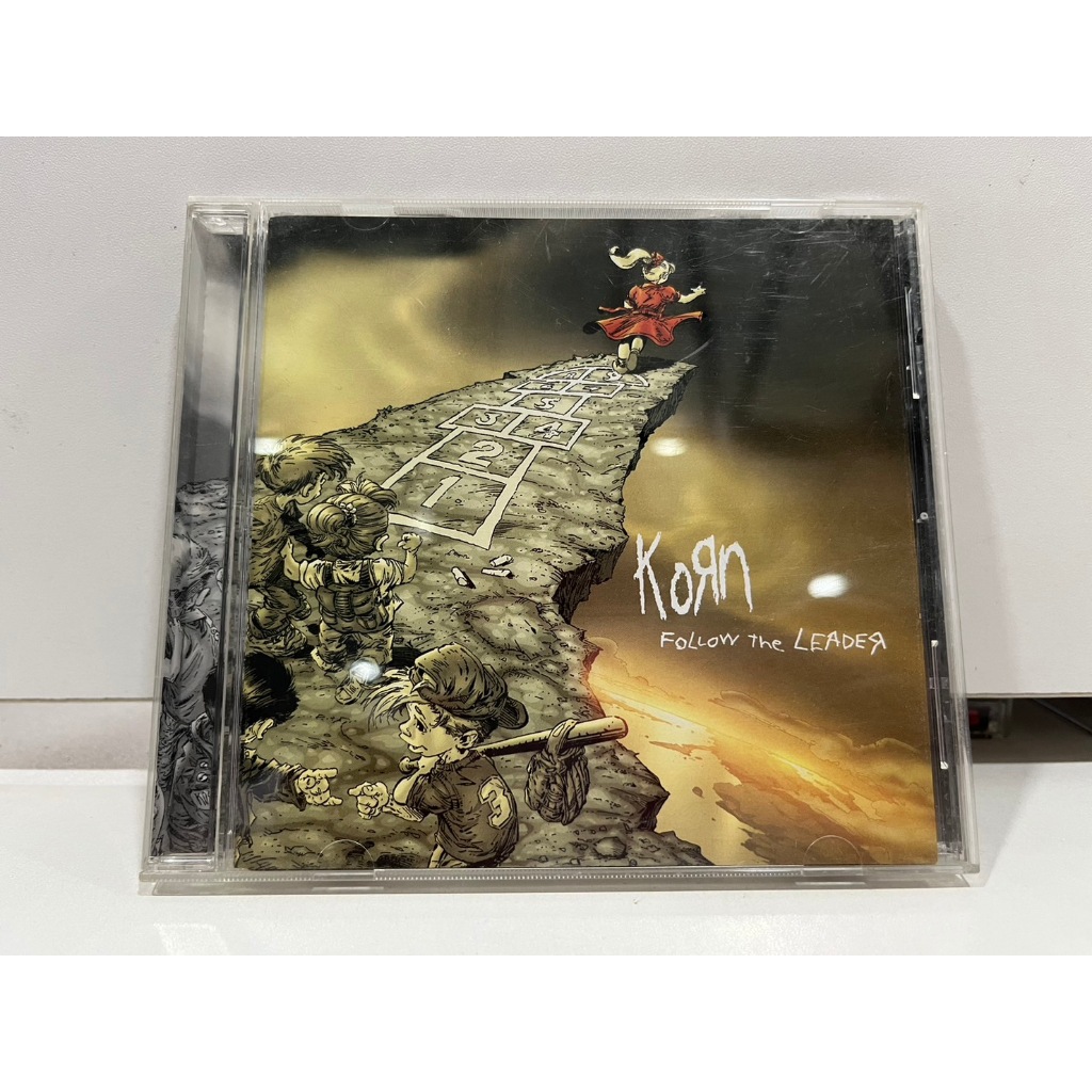 1   CD  MUSIC  ซีดีเพลง    Korn Follow    the LEADER  (A6D42)