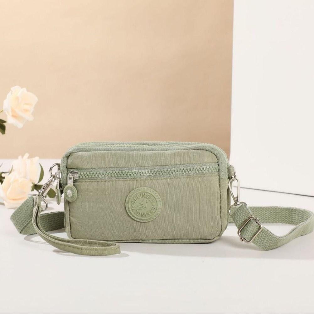 (มีส่งด่วน)ifashionbag(IF2012) กระเป๋าสะพายข้างใส่มือถือ-แนวนอน เป็นผ้าไนล่อนกันน้ำได้ มี4 ซิป - รูปที่ 6