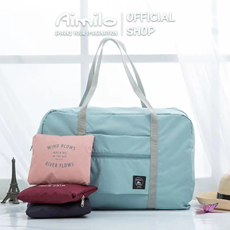 Aimilo shop กระเป๋าผ้าบรรจุของใช้ต่าง ๆ พับเก็บได้ และสามารถหิ้วได้หรือนำไปเสียบบนแกนกระเป๋าเดินทางเพื่อลาก