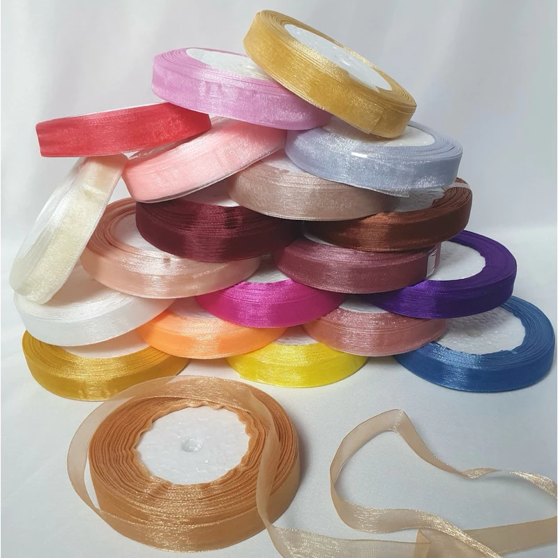 ริบบิ้นผ้าแก้ว กว้าง 1.5 ซม. มีหลายสี ยกม้วนประมาณ 38-42 เมตร