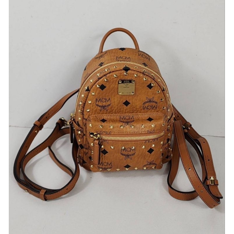 🎒กระเป๋าเป้ สวย สีออริ มีหมุดคร้า🎒New MCM Studded Outline Visetos Stark Bebe Boo X-Mini Backpack