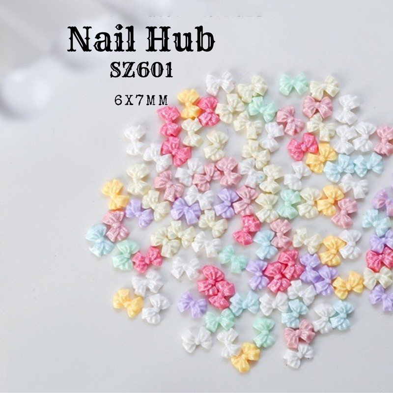 AC.199 ร้านไทย แพ็ค 10 ชิ้น พร้อมส่ง โบว์เรซินติดเล็บ3D สีพาสเทลชิมเมอร์ น่ารักมาก รหัส SZ601 ขนาด 6 × 7mm