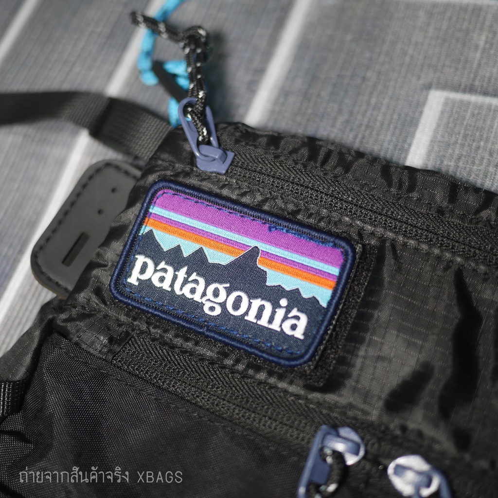 Patagonia สะพายข้างผ้าร่มแบนแนบตัว น้ำหนักเบา พับได้ สายเชือก ปรับสั้นยาวได้ มีซับไหล่