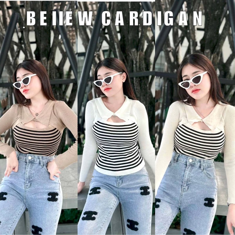 Beiiew เสื้อแต่งทรงคอโปโลดระดุมหนึ่งเม็ดเจาะเว้าอก แขนยาวแต่งเป็นผ้าไหมพรมสีพื้นสลับลำตัวเป็นเงานผ้าทอลายเส้น