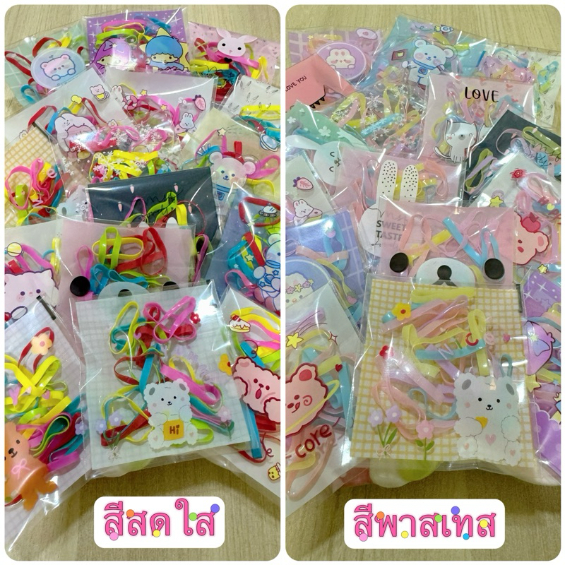 หนังยางรัดผม เส้นใหญ่ ห่อละ 20 เส้น บรรจุห่อลายการ์ตูน คละลาย ห่อละ 1 บาท