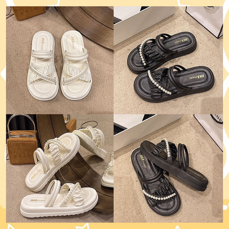 LGShoes ใหม่มาก รองเท้าแตะแบบสวม แต่งดีเทลสายไขว้ ประดับไข่มุกเก๋ๆ สวมใส่สบายดีไซส์สวยมาก พื้นนิ่มสบายเท้า มี 2สีแบบปัง