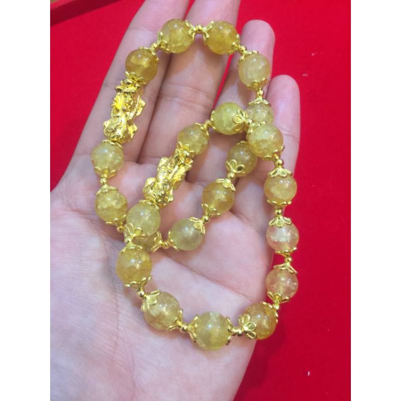 ข้อมือ ปี่เซียะ หุ้มทอง 96.5% สีหินไหมทอง คั่นดอกพิกุลทอง สินค้าพรีเมี่ยม